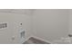 Laundry room with built-in shelving and vinyl flooring at 1403 Gentry Pl, Salisbury, NC 28146