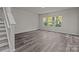 Spacious living room with wood-look floors and large windows at 1403 Gentry Pl, Salisbury, NC 28146