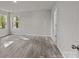 Spacious bedroom with wood-look floors and large windows at 1403 Gentry Pl, Salisbury, NC 28146