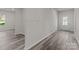 Open entryway with grey wood-look floors and views to the living room at 1403 Gentry Pl, Salisbury, NC 28146