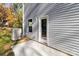 Exterior side of house, gray siding, window, door at 1403 Gentry Pl, Salisbury, NC 28146