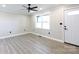 Bright living room with wood-look floors and ceiling fan at 1554 Lynwood Dr, Lancaster, SC 29720