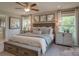 Spacious bedroom with a large bed, two nightstands, and plenty of natural light at 2572 Blue Sky Meadows Dr, Monroe, NC 28110