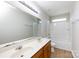 Clean bathroom with double vanity, tub, and updated flooring at 3810 Port Richmond Ave, Gastonia, NC 28056