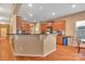 Kitchen with an island, hardwood floors, and brown cabinets at 5146 Elementary View Dr, Charlotte, NC 28269