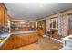 Kitchen with wood cabinets, tile floor, and ample storage at 108 Leslie Dr, Shelby, NC 28152