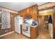 View of kitchen with wood cabinets, stove, refrigerator, and microwave at 108 Leslie Dr, Shelby, NC 28152