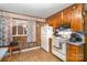 Kitchen features wood cabinets, a stove and refrigerator at 108 Leslie Dr, Shelby, NC 28152