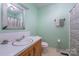 Bathroom with single sink vanity, shower, and decorative mirror at 108 Leslie Dr, Shelby, NC 28152