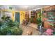 Sunroom with view into kitchen, filled with plants and natural light at 108 Leslie Dr, Shelby, NC 28152