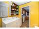 Laundry room with washer, dryer, and view into kitchen at 108 Leslie Dr, Shelby, NC 28152
