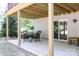 Covered patio with a table and chairs, adjacent to a sliding glass door at 3995 Burton Ln, Denver, NC 28037