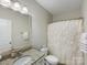 Bathroom with granite vanity and a neutral shower curtain at 1838 Larkspur Way, Fort Mill, SC 29708