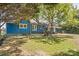 Charming blue house with a spacious lawn at 600 Main St, Stanley, NC 28164