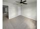 Spacious bedroom with ceiling fan and carpeted floor at 6623 Sweetfield Dr, Charlotte, NC 28269