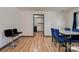 Dining area with view of kitchen, featuring hardwood floors and modern chairs at 710 W Elm St, Shelby, NC 28150