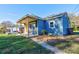 Charming blue house with a covered porch and well-maintained yard at 710 W Elm St, Shelby, NC 28150