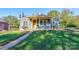 Charming one-story home with a yellow porch at 710 W Elm St, Shelby, NC 28150