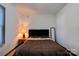 Simple bedroom with a double bed and a side table at 710 W Elm St, Shelby, NC 28150
