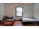 Bedroom with twin beds, one with a floral coverlet at 710 W Elm St, Shelby, NC 28150