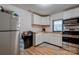 Galley kitchen with stainless steel appliances and ample cabinet space at 710 W Elm St, Shelby, NC 28150