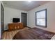 Bedroom with a dresser, double bed, and large window at 710 W Elm St, Shelby, NC 28150
