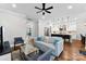 Open concept living room with a view into the kitchen and dining area at 2200 Stratford Ave, Charlotte, NC 28205