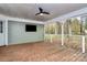 Screened porch with wooden deck, ceiling fan, and wooded views at 3172 Merritt Ln, Lancaster, SC 29720