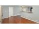 Open kitchen with breakfast bar and hardwood floors at 5682 Stafford Rd, Charlotte, NC 28215