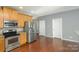 Kitchen with stainless steel appliances and wood cabinets at 5682 Stafford Rd, Charlotte, NC 28215