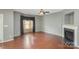 Living room featuring hardwood floors, fireplace, and bay window at 5682 Stafford Rd, Charlotte, NC 28215