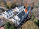 An aerial view showcasing a row of modern townhouses in an urban setting at 1417 Collier Walk Aly # Csw0207, Charlotte, NC 28205