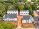 An aerial view of a residential community with multiple townhome style homes at 1417 Collier Walk Aly # Csw0207, Charlotte, NC 28205