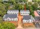 An aerial view showcasing a group of townhomes and the surrounding community at 1421 Collier Walk Aly # Csw0209, Charlotte, NC 28205