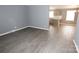 Spacious living room with gray walls and wood-look flooring at 192 Allen Pond Rd, Wadesboro, NC 28170