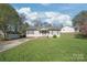 Tan house exterior with front yard and driveway at 314 Echo Ave, Kannapolis, NC 28081