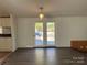 Bright dining area with vinyl flooring and access to the backyard at 36245 Nugget Rd # 2, New London, NC 28127