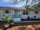 Charming ranch home with mint green door and shutters at 6908 Oakland Ave, Indian Trail, NC 28079