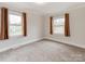 Well-lit bedroom with neutral walls and carpet flooring at 808 Linwood Rd, Kings Mountain, NC 28086