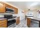 Spacious kitchen with stainless steel appliances and wood cabinets at 1009 Amber Ct, China Grove, NC 28023