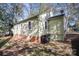 Side view of the house with green exterior and brick base at 1047 Ebenezer Avenue Ext, Rock Hill, SC 29732