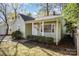 Charming light green house with a front porch and well-manicured yard at 1047 Ebenezer Avenue Ext, Rock Hill, SC 29732