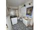 Bathroom with black and white tile floor, white vanity, and shower/tub combo at 1060 Mcdow Dr, Rock Hill, SC 29732