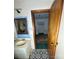 View of a bathroom with patterned tile floor, vanity sink, and a doorway leading to another room at 1060 Mcdow Dr, Rock Hill, SC 29732