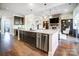 Open concept kitchen with large island and stainless steel dishwasher at 1217 Rosecliff Dr, Waxhaw, NC 28173