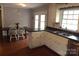 Bright kitchen features white cabinets, double sink, and wood flooring at 1572 W Lakewood Dr # 19, Rock Hill, SC 29732