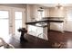 Galley kitchen with white cabinets, dark countertops, and a dining area at 1572 W Lakewood Dr # 19, Rock Hill, SC 29732