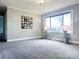 Bedroom with neutral carpeting, large window, and ample closet space at 2202 16Th Ne Ave, Hickory, NC 28601