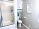 Clean bathroom with a shower/tub combo and linen cabinet at 2202 16Th Ne Ave, Hickory, NC 28601