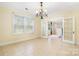 Spacious dining room, featuring French doors and tile floors at 3635 Tryon Courthouse Rd, Cherryville, NC 28021